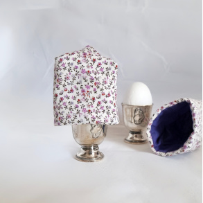 �ggevarmer med sm� lilla blomster