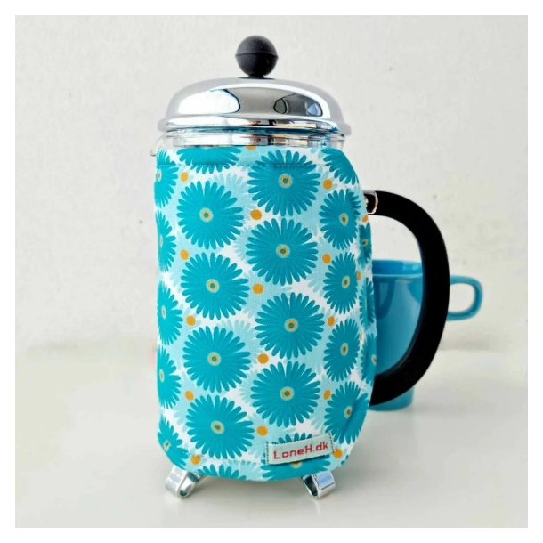 Kaffefrakke med et hav af bl blomster