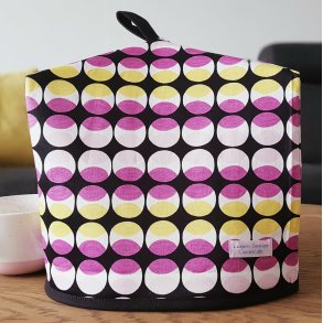 Thehtte i sort, gul og lyserd