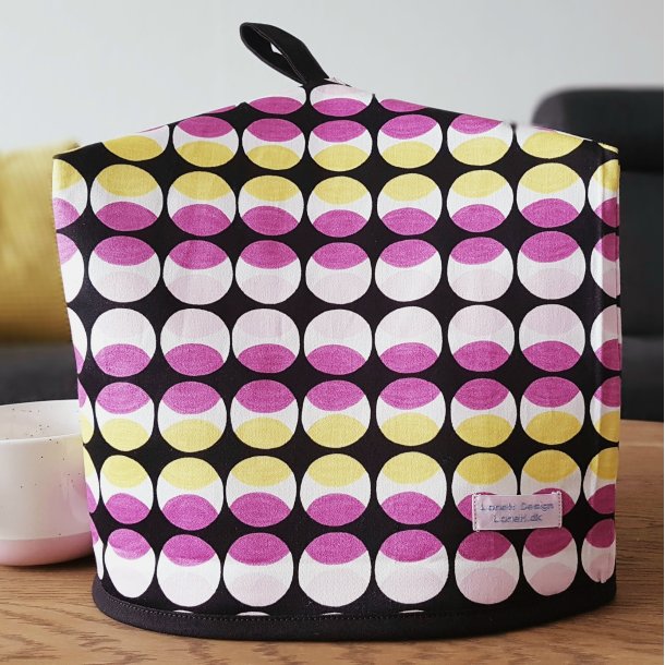 Thehtte i sort, gul og lyserd