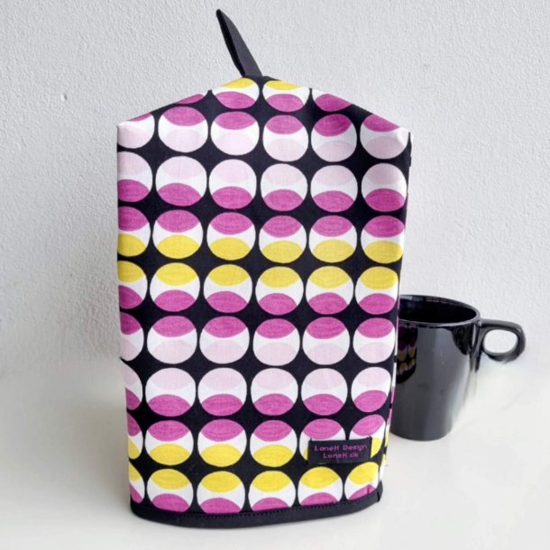 Kaffehtte i sort med cirkler i lilla og gul