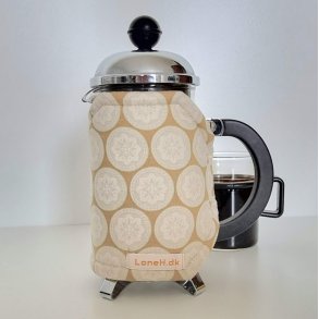 Kaffevarmer i mrk beige med mintgrnt