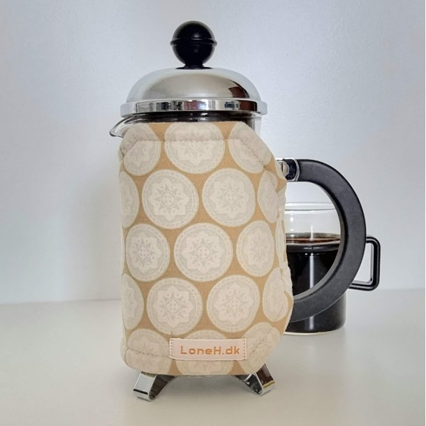 Kaffevarmer i mrk beige med mintgrnt