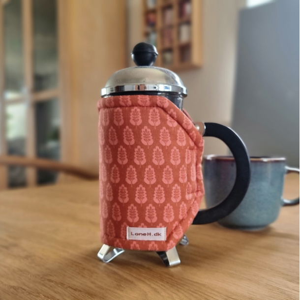 Kaffevarmer paprika farvet med bladm�nster