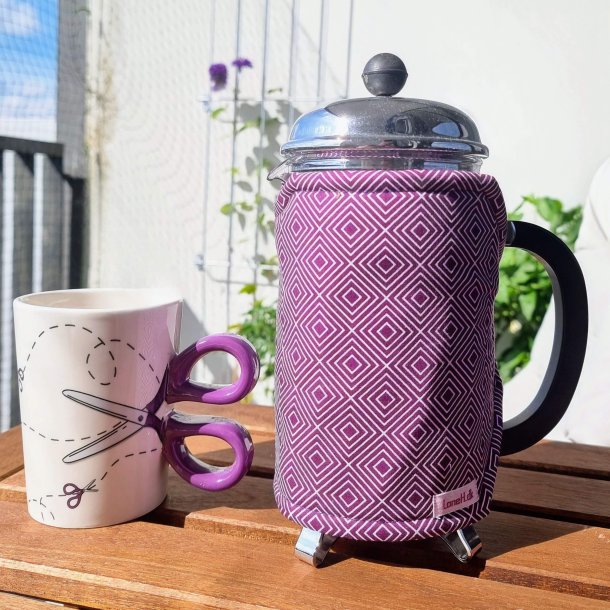 Kaffevarmer lilla med hvidt mnster