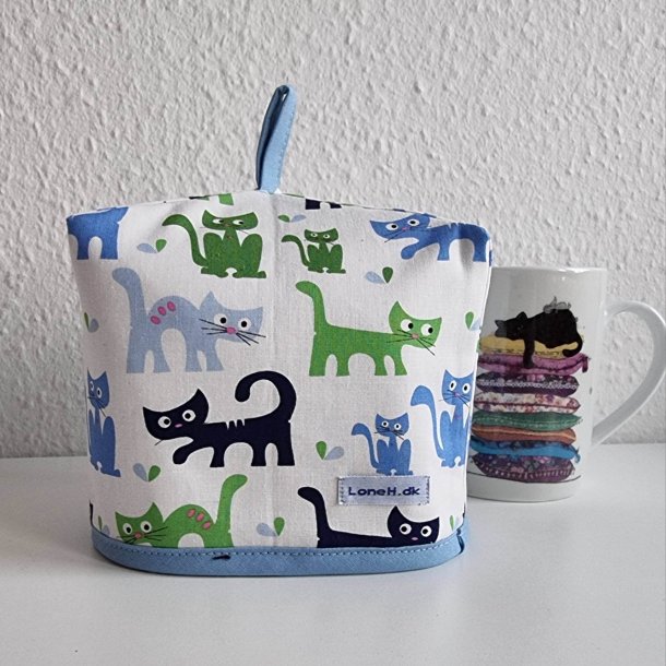 Kop varmer med katte