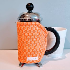 Kaffevarmer i orange til den lille stempelkande