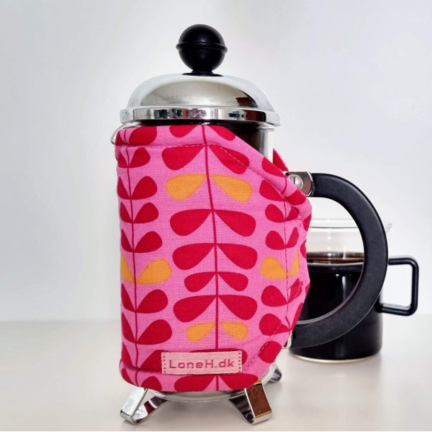 Pink kaffevarmer med blade i orange og rd