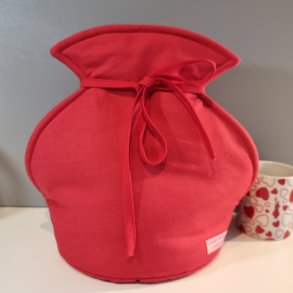 Tevarmer i rd til at stte tepotten ned i