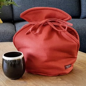 Tevarmer rustfarvet  til stte tekanden ned i.