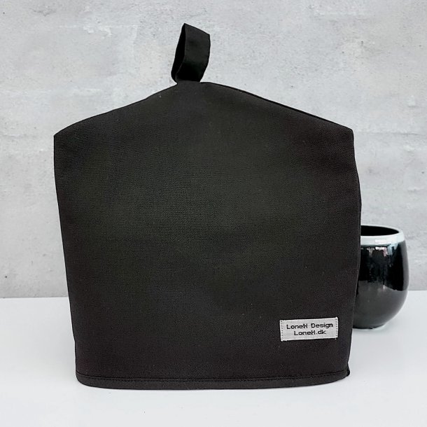 Stor helt sort tehtte i et kraftigt materiale