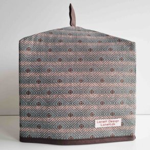 Tehtte i et naturfarvet i geometrisk mnster