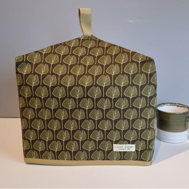 En lille tehtte i olivengrn med blade