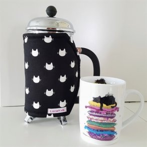 Kaffevarmer med hvide katte hoveder