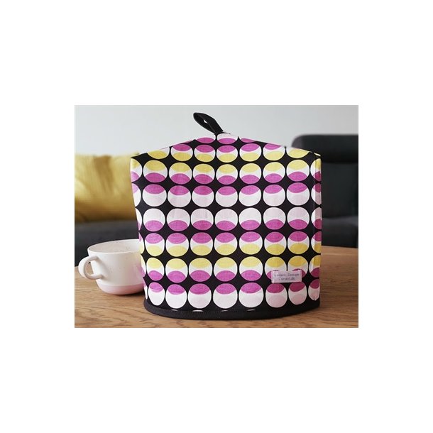 Stor tehtte i sort, gul og lyserd