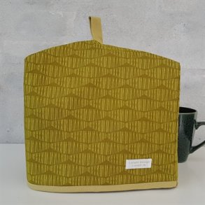 Tehtte mrkegul med blger 